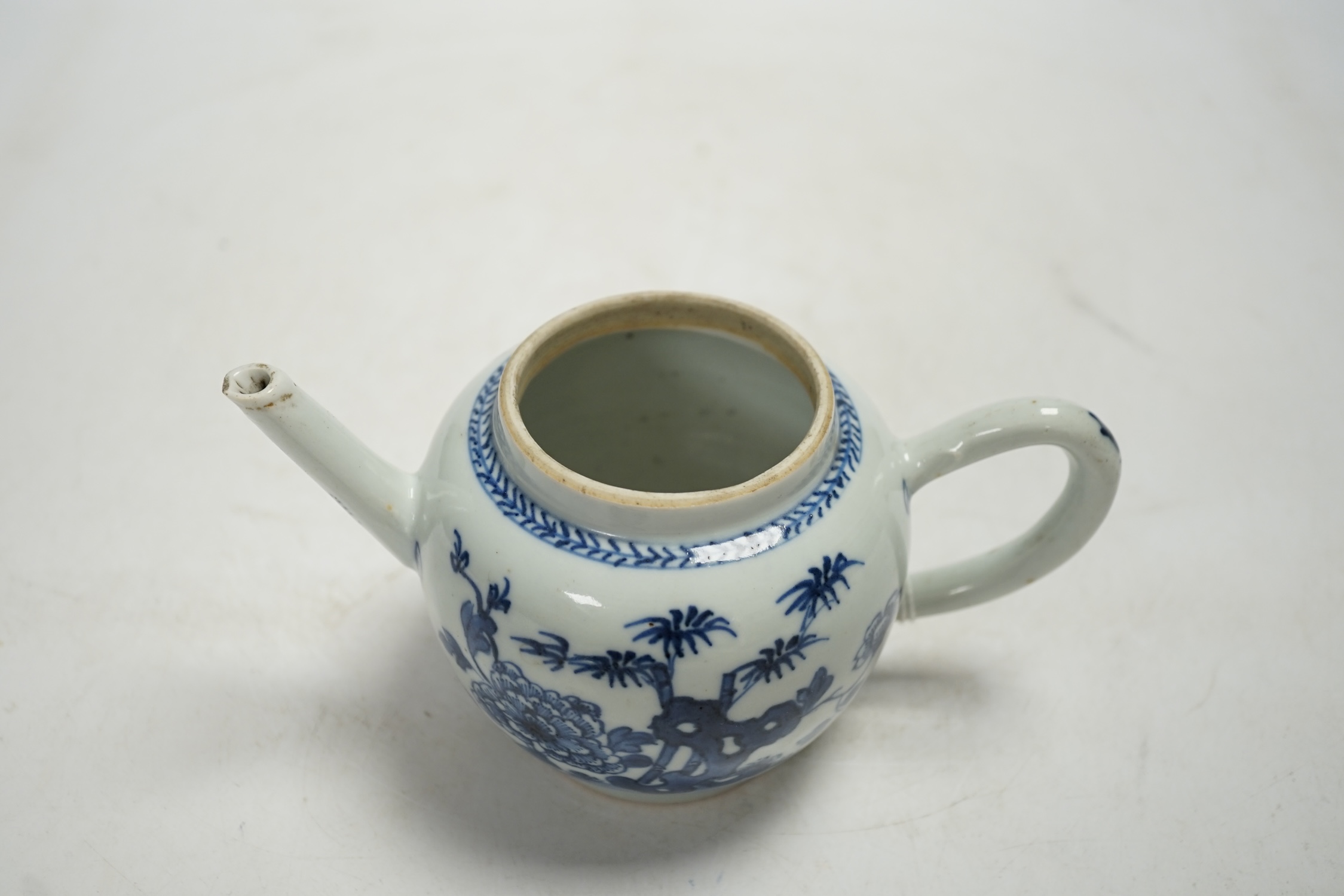 A Chinese blue and white teapot and cover, Qianlong period, 13cm high. Condition - fair